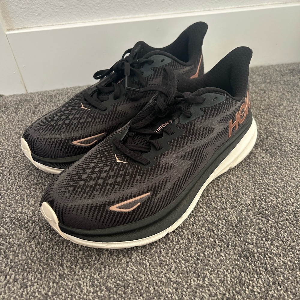 HOKA Women's Black and rose gold Clifton 9